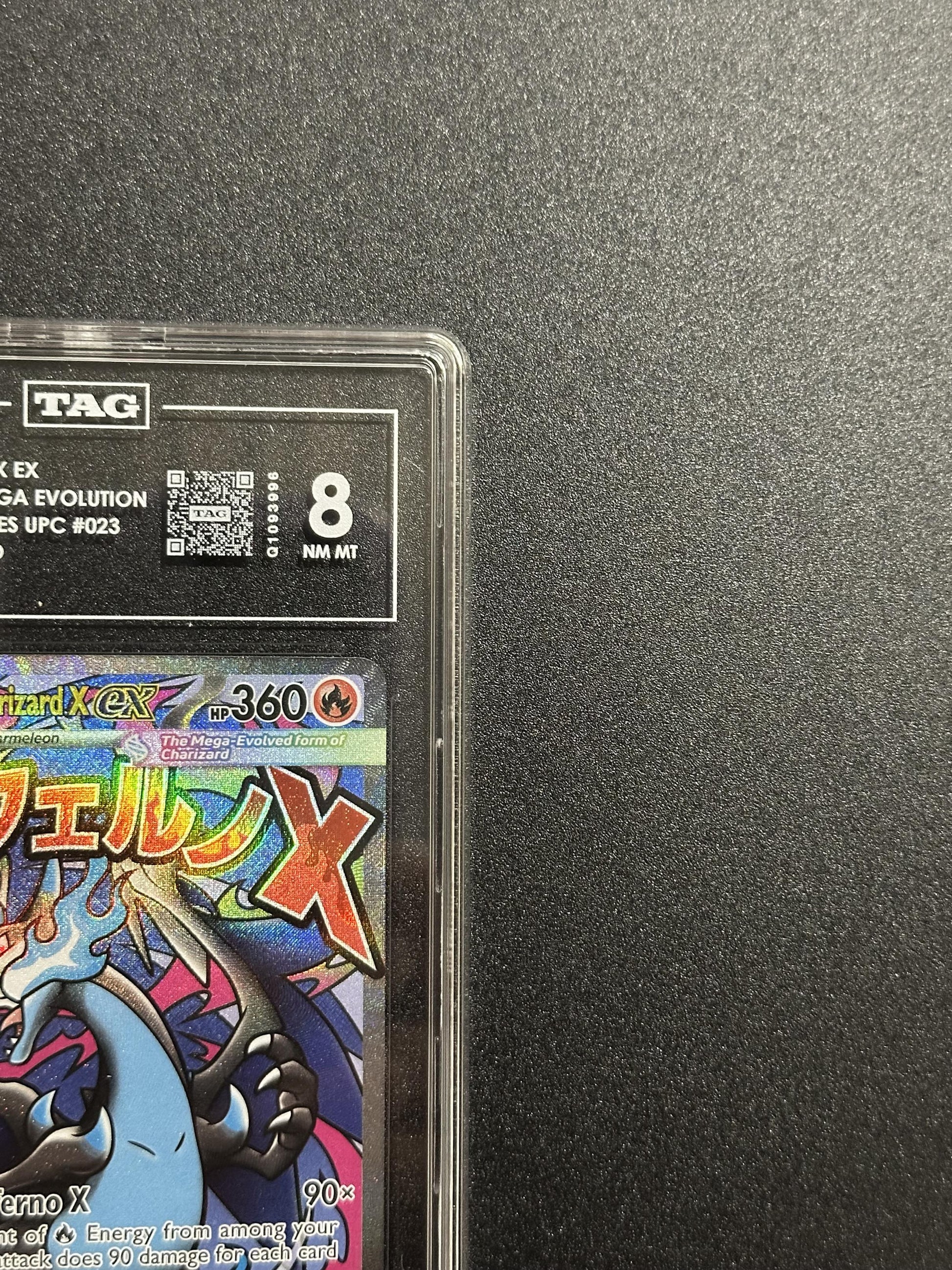 Mega Charizard X ex 023 - top left corner